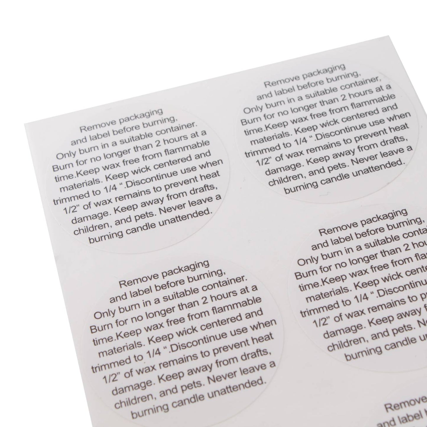 Sheet of round white caution labels with black text providing candle burning safety instructions for soy wax candles, designed for use in lamps and lighting, candlemaking supplies, and best sellers collections.