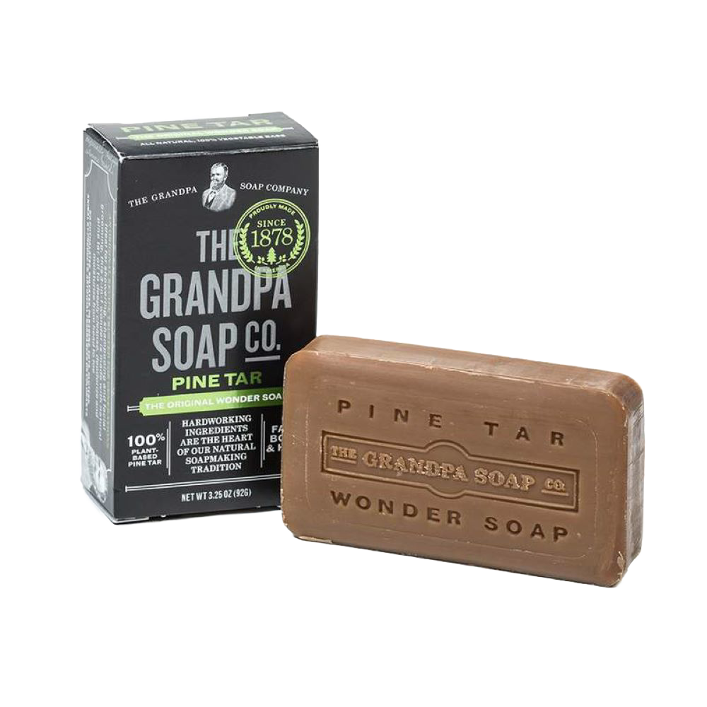 Rustic handcrafted pine tar soap bar with embossed branding, made in USA, ideal for Grooming and Personal Hygiene, Health & Wellness, and Soaps collections.