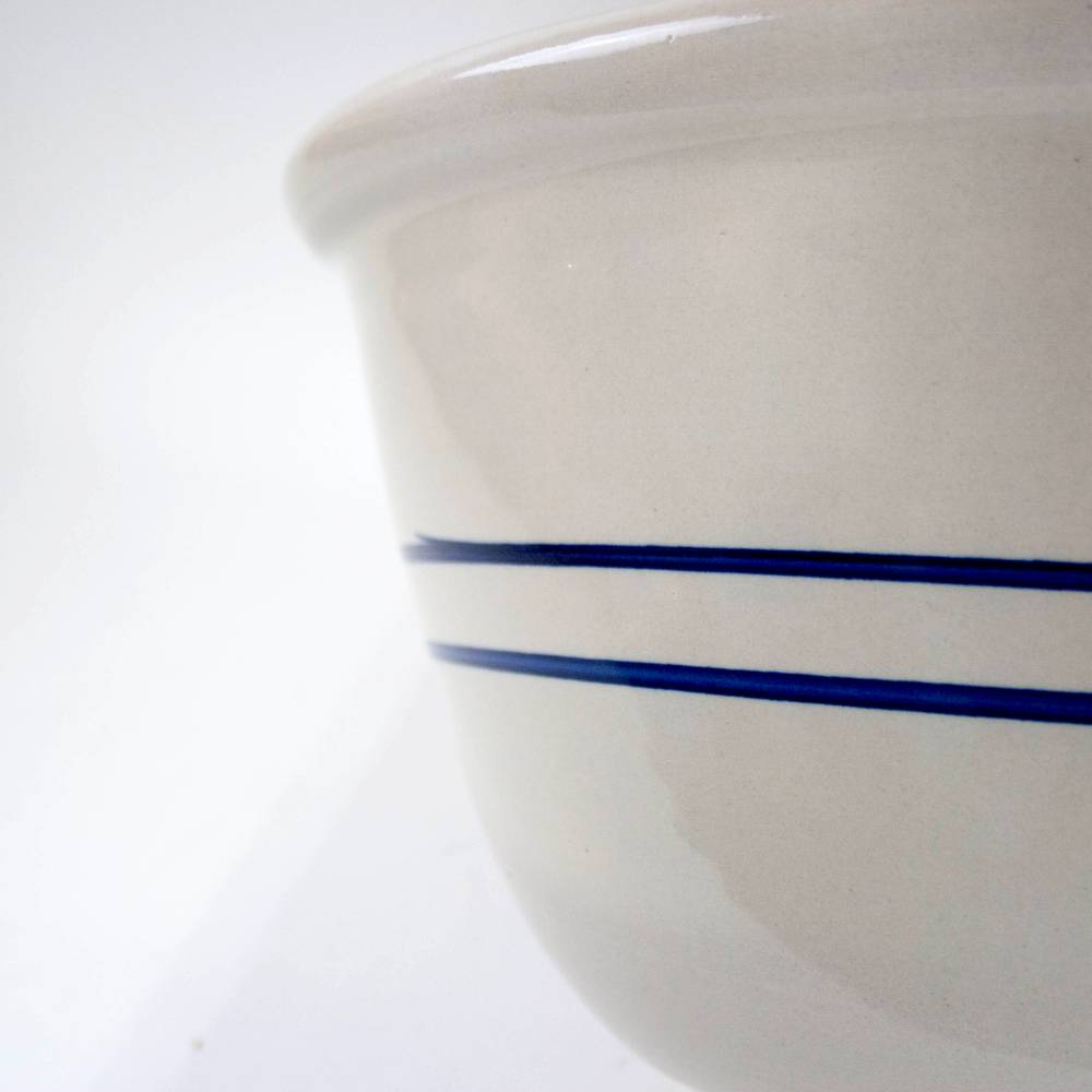 Close-up of a handcrafted 16-inch stoneware mixing bowl with heritage blue stripes, made in USA, ideal for Kitchen & Food, Cookware, Baking Supplies, and Storage and Serving collections.