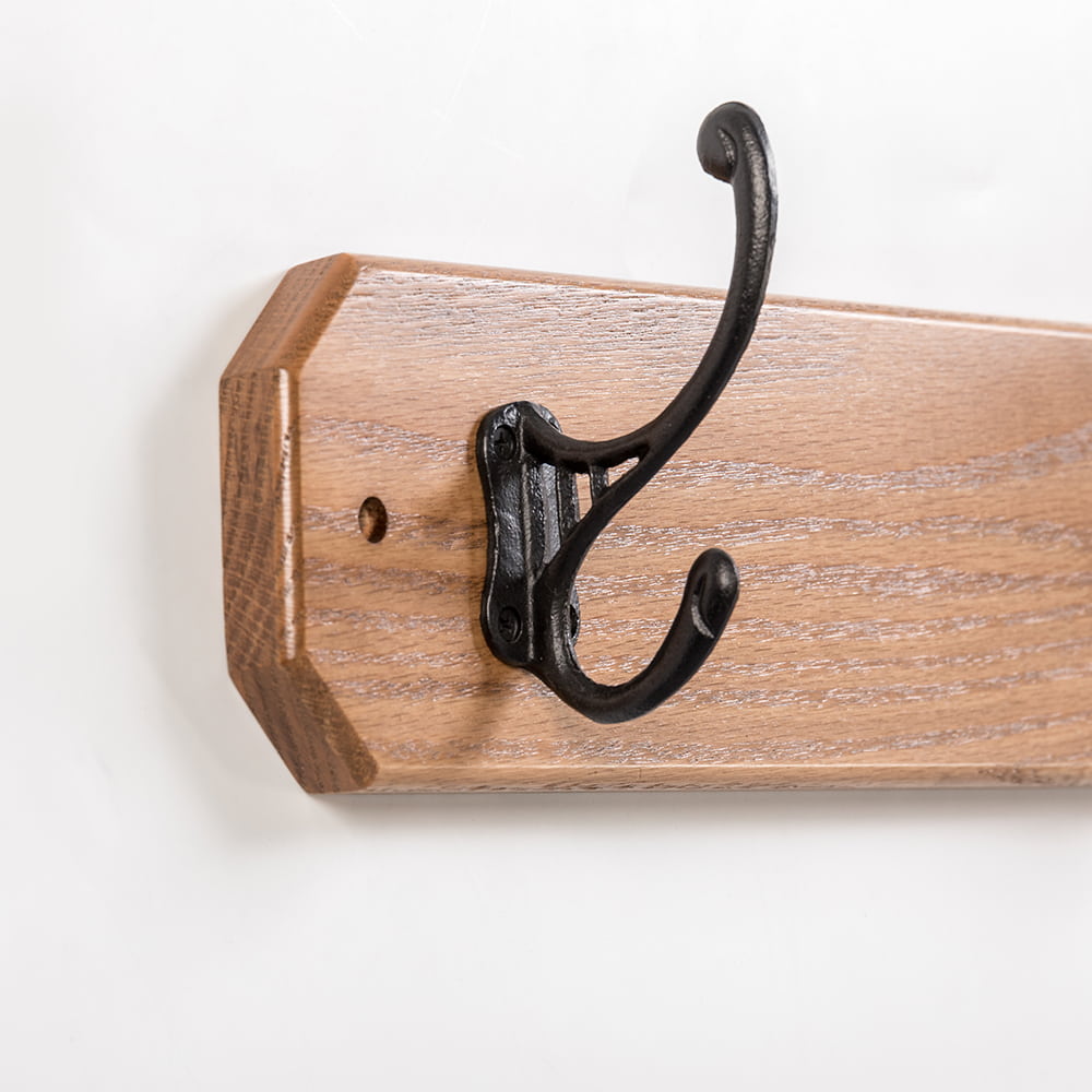 Handcrafted oak wallboard with a double black metal hook, Amish made in the USA, perfect for organizing coats and featured in Home & Decor, Household Helpers, and Best Sellers collections.