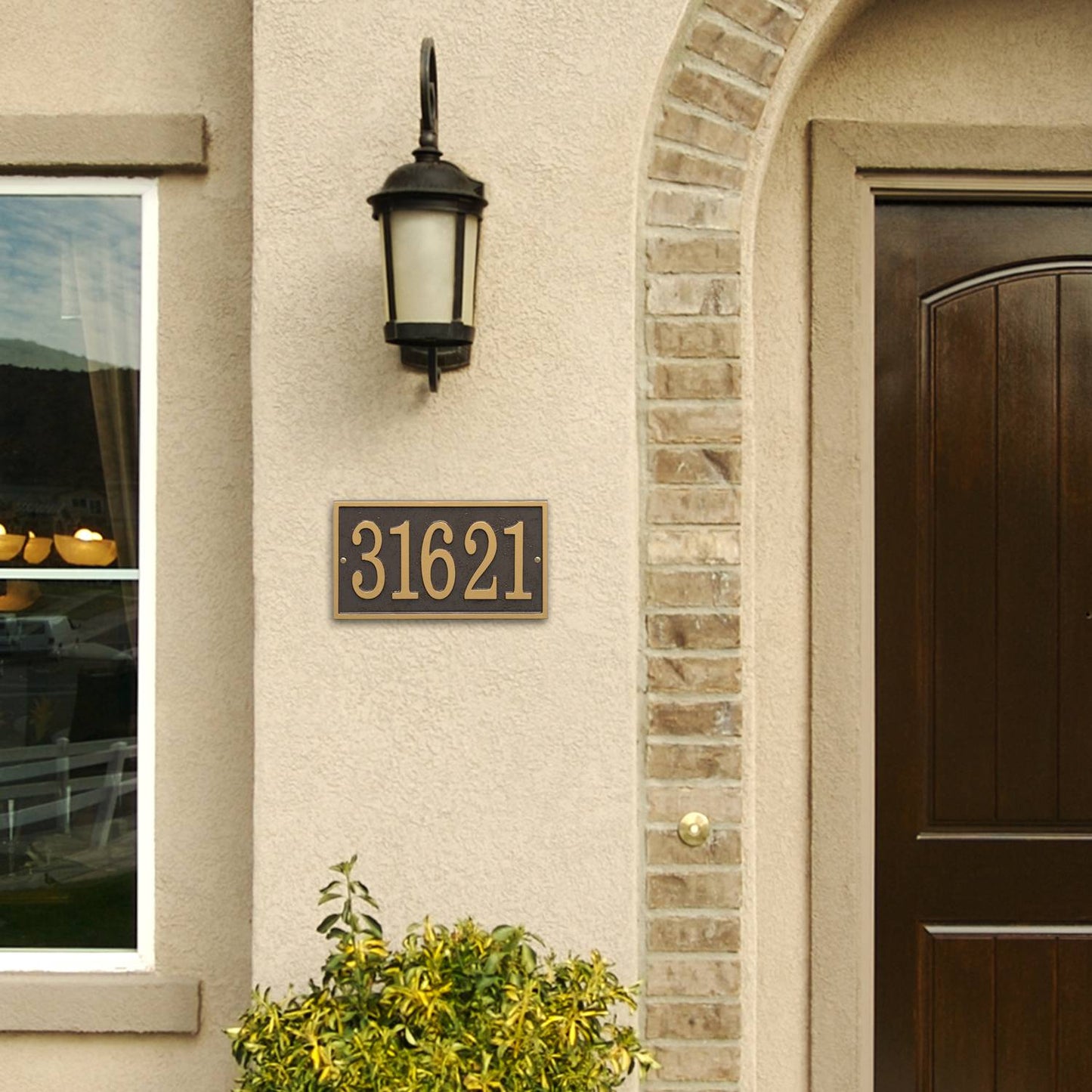 Handcrafted rectangular bronze and gold address plaque with raised numbers mounted on exterior stucco wall under black outdoor lantern, enhancing curb appeal in Home & Decor and USA Made collections.