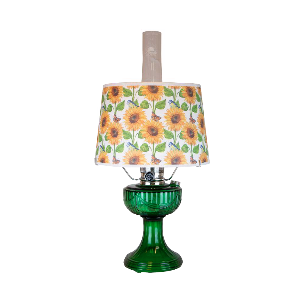 Unique handcrafted oil lamp with an Ohio-made emerald glass base and a bright sunflower-patterned shatterproof parchment shade, perfect for Farm, Garden & Tool and Lamps & Lighting collections.