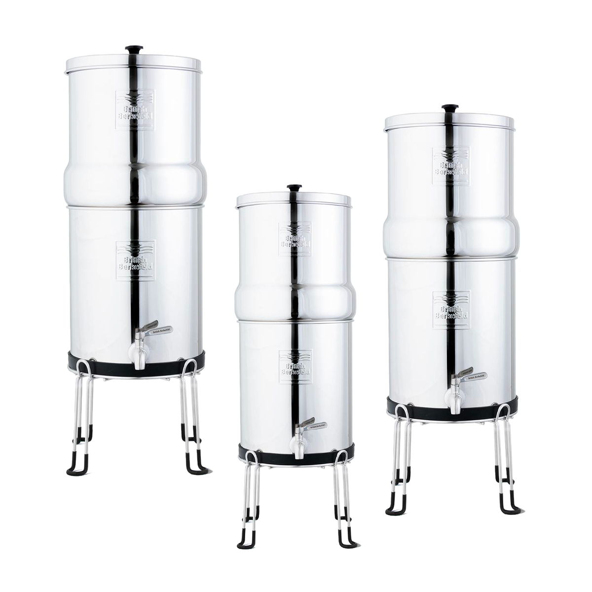 Three polished stainless steel gravity water filters elevated on handcrafted sturdy stands with protective feet, designed for easy dispensing, featured in Appliances and Emergency Supplies collections.