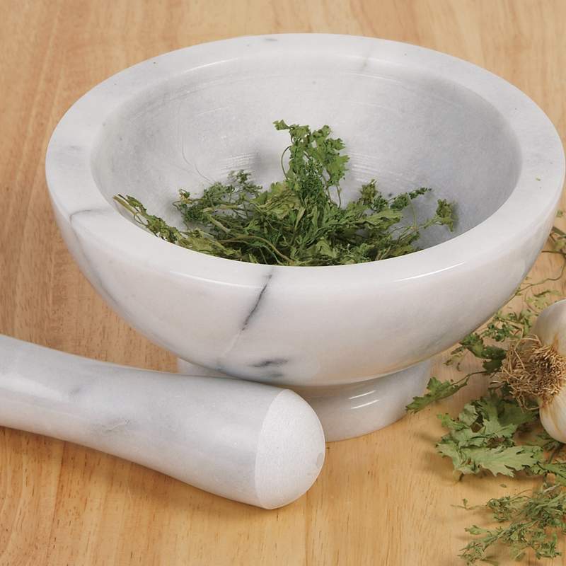 Handcrafted solid marble mortar and pestle with fresh herbs, durable and flavor-neutral, perfect for Kitchen & Food, Food Prep, Choppers and Cutters, Best Sellers, and Promo Eligible collections.