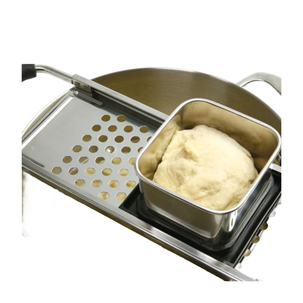 Handcrafted spaetzle maker with sliding hopper holding dough over perforated stainless steel grater, designed for easy noodle preparation, ideal for Kitchen & Food, Cookware, Baking Supplies, and Best Sellers collections.
