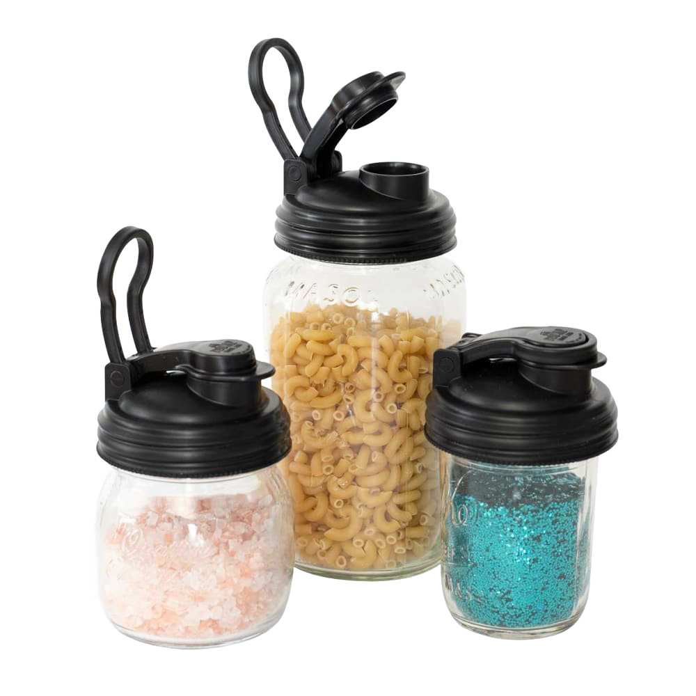 Three clear regular-mouth jars filled with pink salt, pasta, and blue granules, each topped with a black pour lid featuring a flip-top spout and carry loop, made in the USA, ideal for Kitchen & Food, Dinnerware, Kitchen Gadgets, Kitchen Accessories, USA Made, Best Sellers, and Promo Eligible collections.