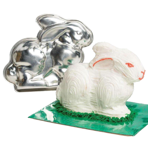 Handcrafted metal bunny cake pan next to a decorated 3D bunny cake with white frosting and green grass detail, featured in Kitchen & Food, Cookware, Baking Supplies, USA Made collections.