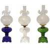 Three handcrafted 22" Princess Feather oil lamps with intricately sculptured bases in blue, clear, and green glass, featuring brass-plated burners and glass chimneys, ideal for Lamps & Lighting and Best Sellers collections.