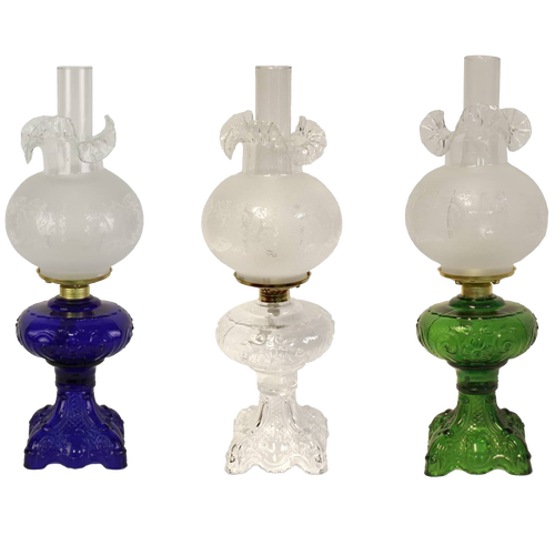 Three handcrafted 22" Princess Feather oil lamps with intricately sculptured bases in blue, clear, and green glass, featuring brass-plated burners and glass chimneys, ideal for Lamps & Lighting and Best Sellers collections.