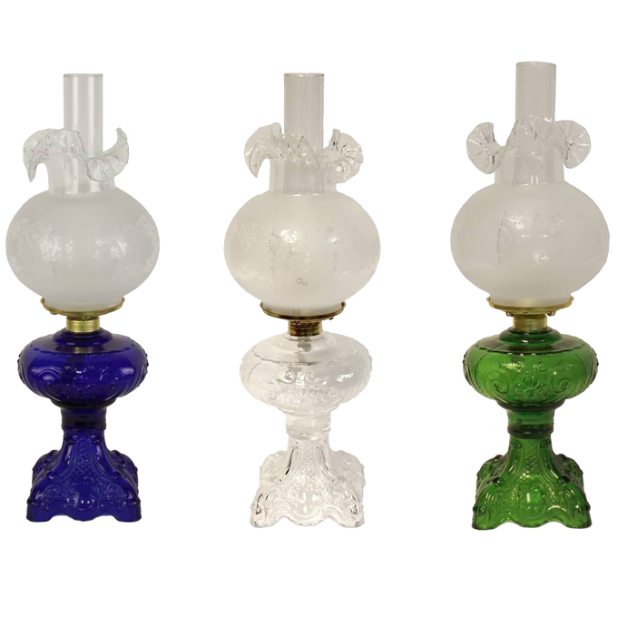 Three handcrafted 22" Princess Feather oil lamps with intricately sculptured bases in blue, clear, and green glass, featuring brass-plated burners and glass chimneys, ideal for Lamps & Lighting and Best Sellers collections.