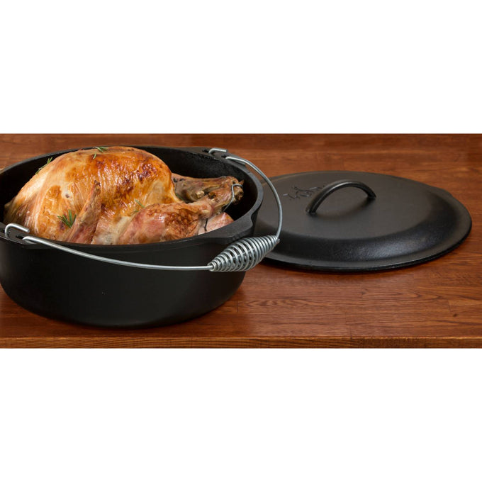 Pre-seasoned cast iron Dutch oven with spiral bail handle and self-basting lid featuring nubs underneath, shown with roasted chicken, ideal for Kitchen & Food, Cookware, Cast Iron, USA Made, and Best Sellers collections.