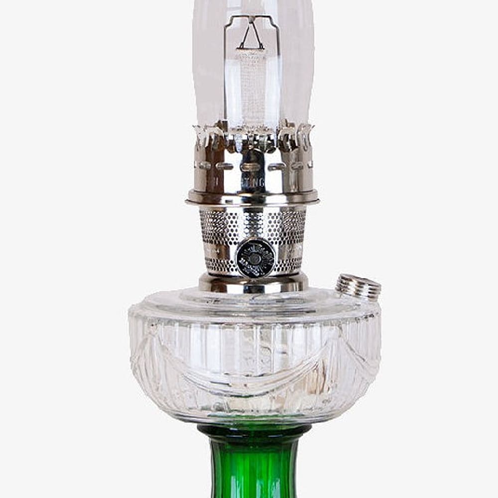 Clear glass oil lamp with emerald green glass base and metal burner featuring a handcrafted sweeping drape pattern, perfect for Lamps & Lighting, Oil Lamps, and Best Sellers collections.
