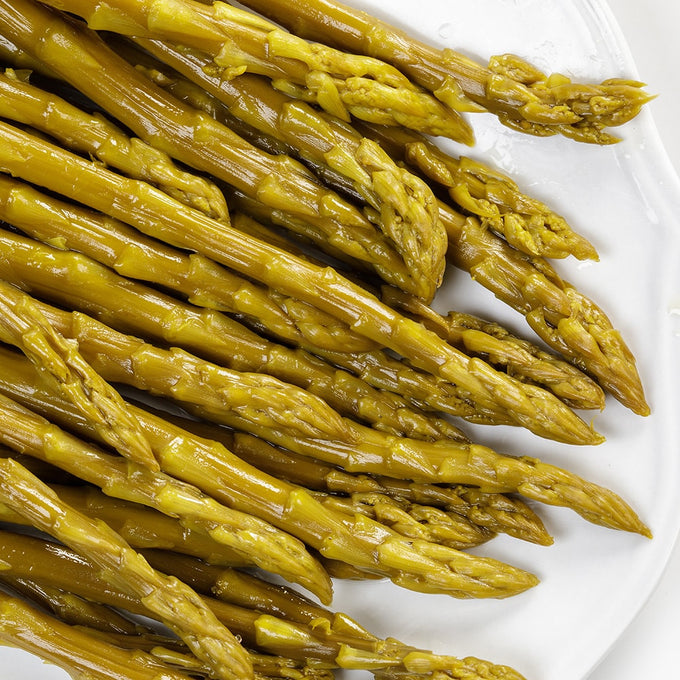 Close-up of handcrafted pickled asparagus spears with tangy flavor, showcasing Amish-made quality, perfect for Kitchen & Food, Food, Pantry, USA Made, Best Sellers, and Promo Eligible collections.