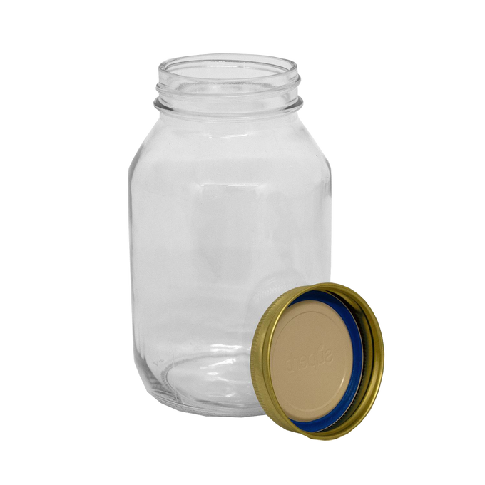Clear sturdy regular-mouth glass jar made in USA with an adjacent gold metal lid featuring a blue sealing ring, ideal for food preservation in Kitchen & Food and Canning collections.