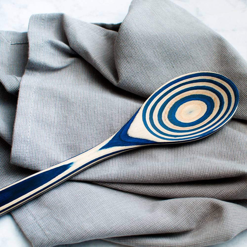 Handcrafted pakkawood spoon featuring concentric blue and natural wood rings, durable and heat resistant, ideal for Kitchen & Food, Kitchen Gadgets, Cooking and Baking Helpers collections.