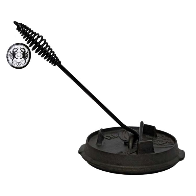 Cast iron Dutch oven lid being lifted by a black metal lid lifter with a coiled handle, designed for safe and comfortable use, featured in Farm, Garden & Tool, Camping, Best Sellers, and Promo Eligible collections.