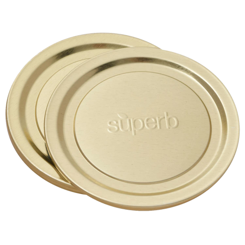 Pair of wide-mouth canning jar lids in a gold tone embossed with "superb," designed for secure food preservation, featured in Kitchen & Food, Canning, and USA Made collections.