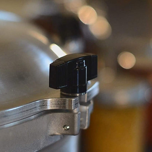 Close-up of a black locking knob on a heavy-duty aluminum pressure canner lid, handcrafted in USA, featured in Farm, Garden & Tool, Kitchen & Food, and Food Preservation collections.