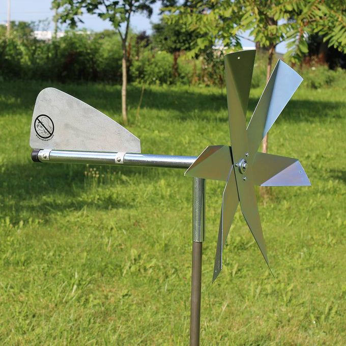 Handcrafted Amish-made windmill with polished metal blades and tail vane mounted on a galvanized steel post, designed for humane mole deterrence in Farm, Garden & Tool, Lawncare, Pest Control, and Best Sellers collections.