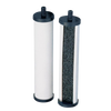 Two cylindrical replacement filtration elements for tabletop water filters, featuring black end caps and a white outer surface with one open side revealing granular filtering material inside.
