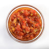 Top-down view of thick, chunky Amish Wedding Salsa in a clear glass bowl, showcasing fresh tomato, pepper, and onion pieces for Kitchen & Food, Snacks and Sweets, Pantry, USA Made, and Best Sellers collections.