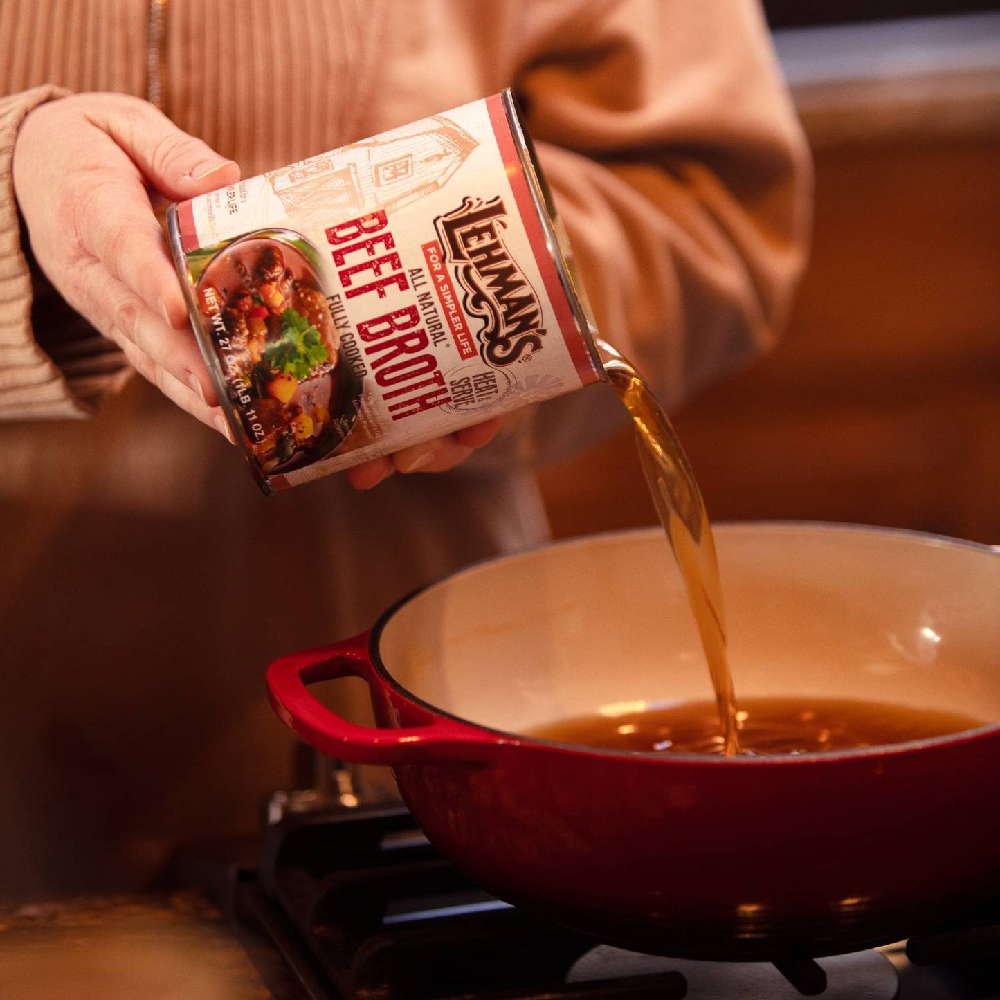 Handcrafted Lehman’s beef broth poured from a 27 oz can into a red enameled pot on a stove, featured for Farm, Garden & Tool, Kitchen & Food, Emergency Supplies, Food, Meats, Best Sellers, and Promo Eligible collections.