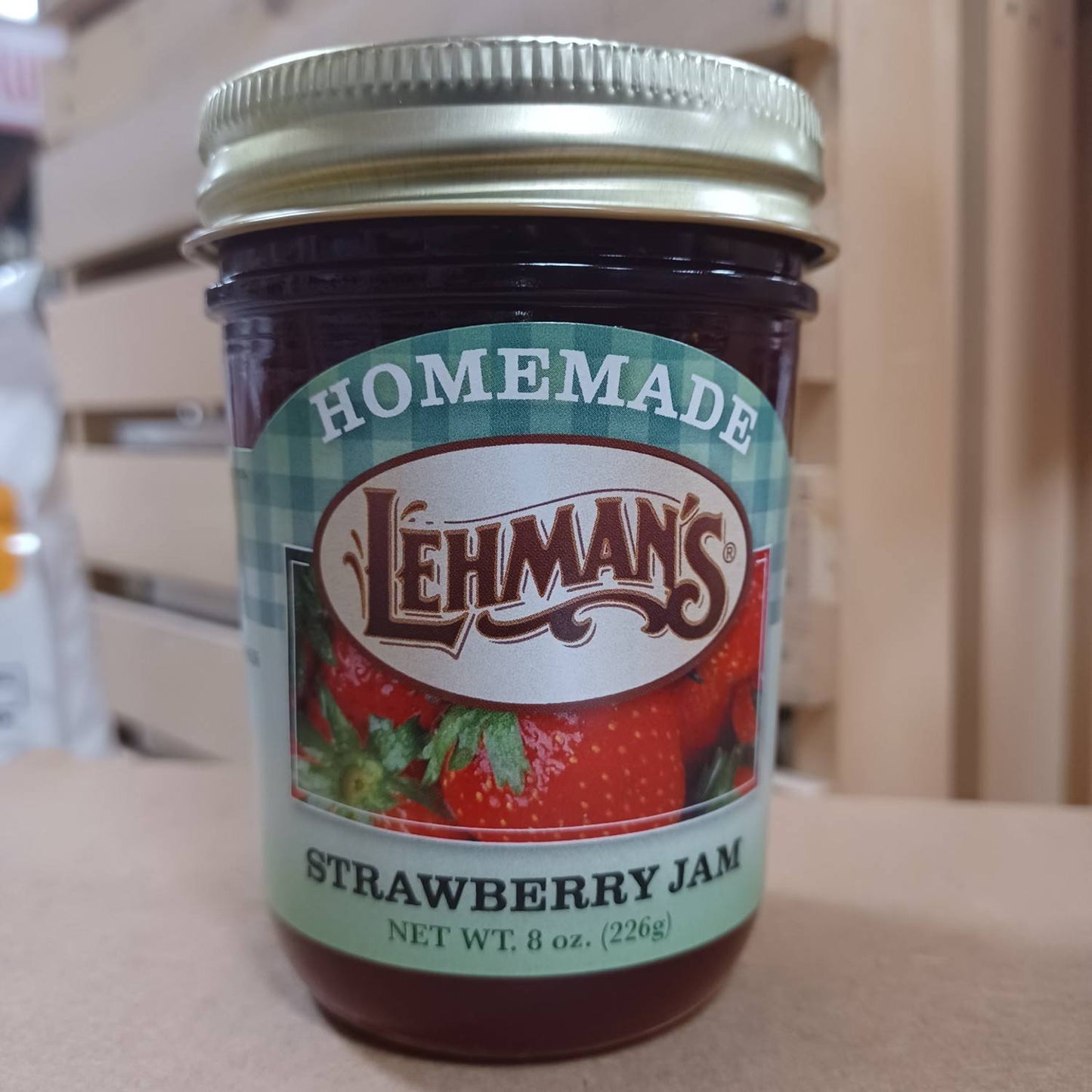 Handcrafted Amish-made Lehman's strawberry jam in an 8 oz glass jar with all-natural ingredients, perfect for Kitchen & Food, Pantry, Peanut Butter & Jellies, USA Made, and Best Sellers collections.