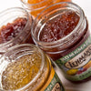 Close-up of handcrafted Amish-made jams and jellies in glass jars with all-natural ingredients, perfect for Kitchen & Food, Pantry, Peanut Butter & Jellies, and USA Made collections.