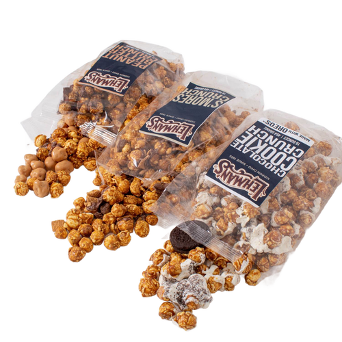Three clear bags of Lehman's caramel popcorn varieties spilling out flavored popcorn pieces, set against a white background, featured in Kitchen & Food and Snacks and Sweets collections.