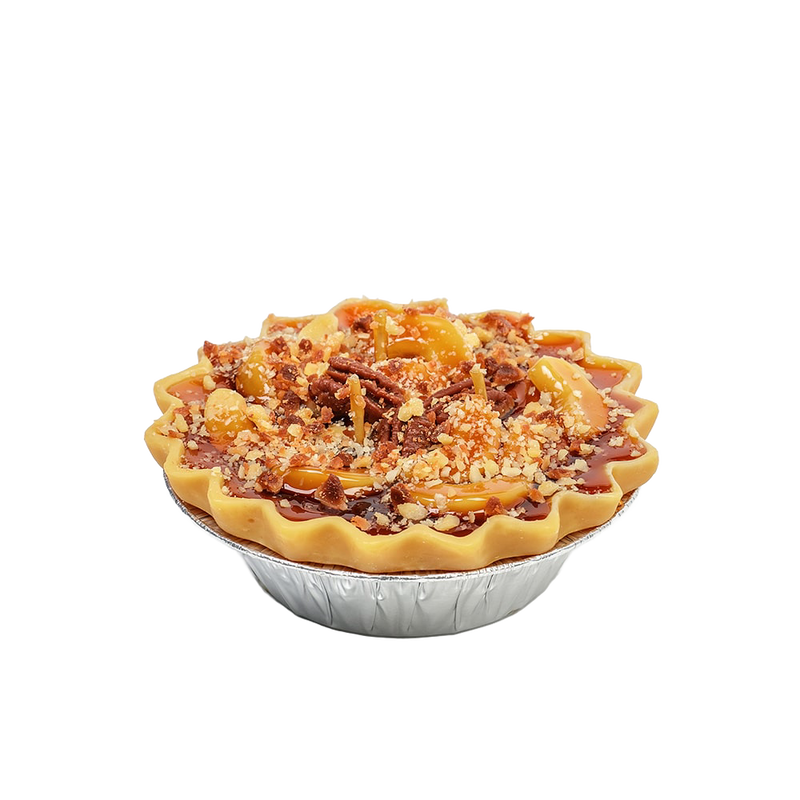 Handcrafted scented dessert candle resembling an apple pie with nut topping and realistic crust, made in USA, featured in Home & Decor, Apple Harvest Supplies, and Best Sellers collections.
