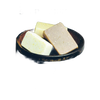 Three handmade soap bars in varying natural colors arranged in a rustic wooden bowl, evoking a simple and wholesome approach to soapmaking for Health & Wellness and Home and Garden How-To Books collections.