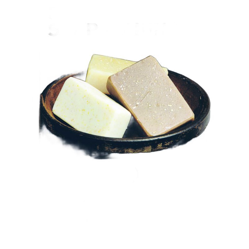 Three handmade soap bars in varying natural colors arranged in a rustic wooden bowl, evoking a simple and wholesome approach to soapmaking for Health & Wellness and Home and Garden How-To Books collections.