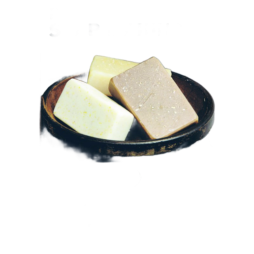 Three handmade soap bars in varying natural colors arranged in a rustic wooden bowl, evoking a simple and wholesome approach to soapmaking for Health & Wellness and Home and Garden How-To Books collections.