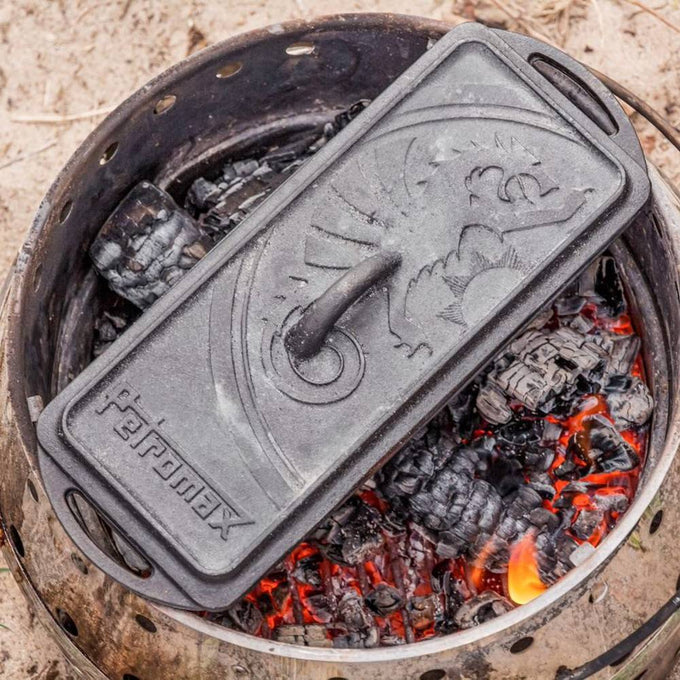 Heavy-duty cast iron loaf pan with embossed lid, handcrafted for even cooking over campfire coals, perfect for farm, garden, kitchen, camping, cookware, and bread making supplies collections.