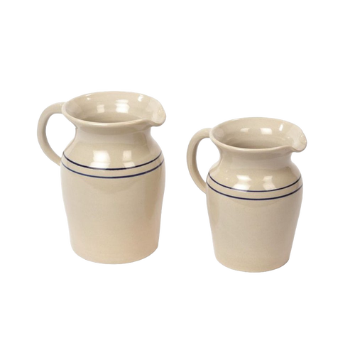 Set of two handcrafted glazed stoneware pitchers in cream with subtle blue stripes, ideal for serving beverages or as decorative vases, featured in Kitchen & Food and USA Made collections.