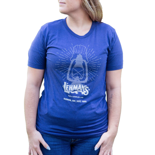 Soft blue handcrafted t-shirt featuring a vintage lantern graphic and "For a Simpler Life" slogan, ideal for Health & Wellness, Emergency Supplies, and Clothing collections.