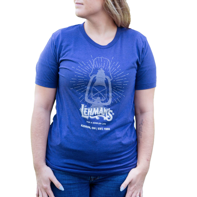 Soft blue handcrafted t-shirt featuring a vintage lantern graphic and "For a Simpler Life" slogan, ideal for Health & Wellness, Emergency Supplies, and Clothing collections.