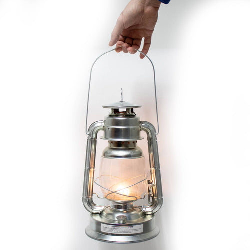 Hand holding a handcrafted silver lantern with a lit flame inside, designed for reliable use in Farm, Garden & Tool, Camping, Emergency Supplies, and Lamps & Lighting collections.
