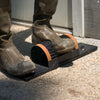 Black replacement nylon brushes mounted on a sturdy base being used to clean muddy boots, ideal for Home & Decor, Household Cleaning, Cleaning Utensils, and Promo Eligible collections.