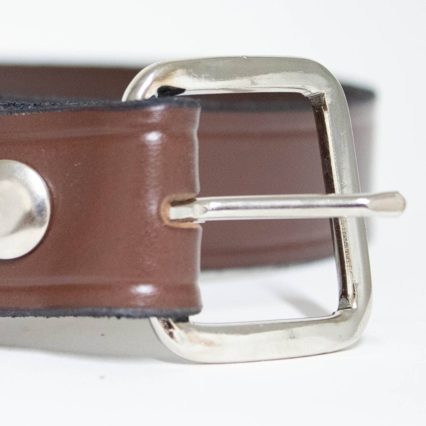 Close-up of a handcrafted Amish leather belt in rich brown with a sturdy chrome buckle, highlighting quality and durability from the USA Made, Amish Made, Best Sellers, and Clothing and Accessories collections.