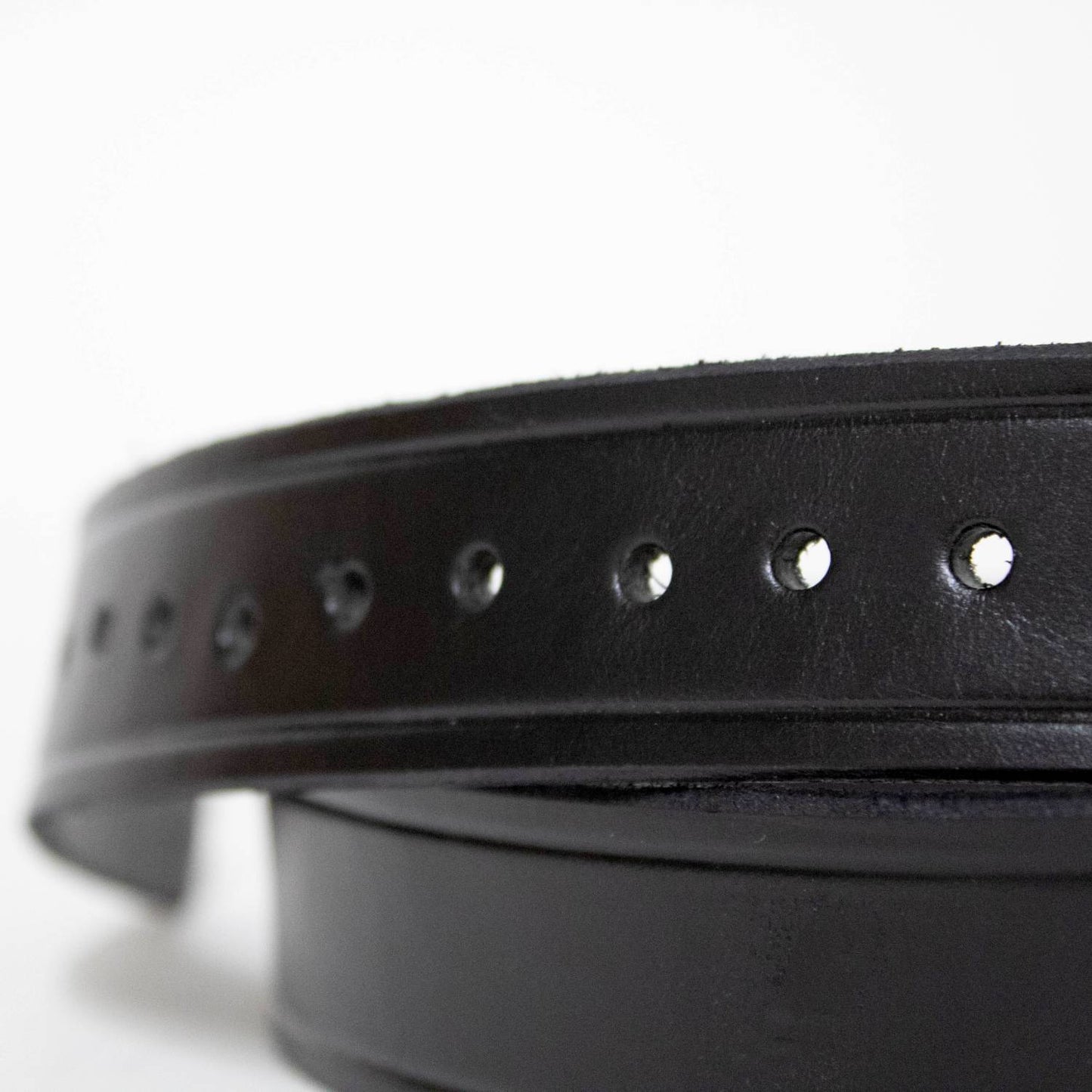 Close-up of a handcrafted Amish made black genuine cowhide leather belt featuring evenly spaced adjustment holes, part of Health & Wellness, USA Made, Clothing and Accessories, Best Sellers, and Promo Eligible collections.