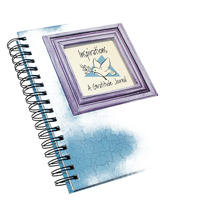 Spiral-bound gratitude journal with blue distressed cover and framed inspirational dove illustration, promoting mindful writing in Books and Heritage and Lifestyle Books collections.