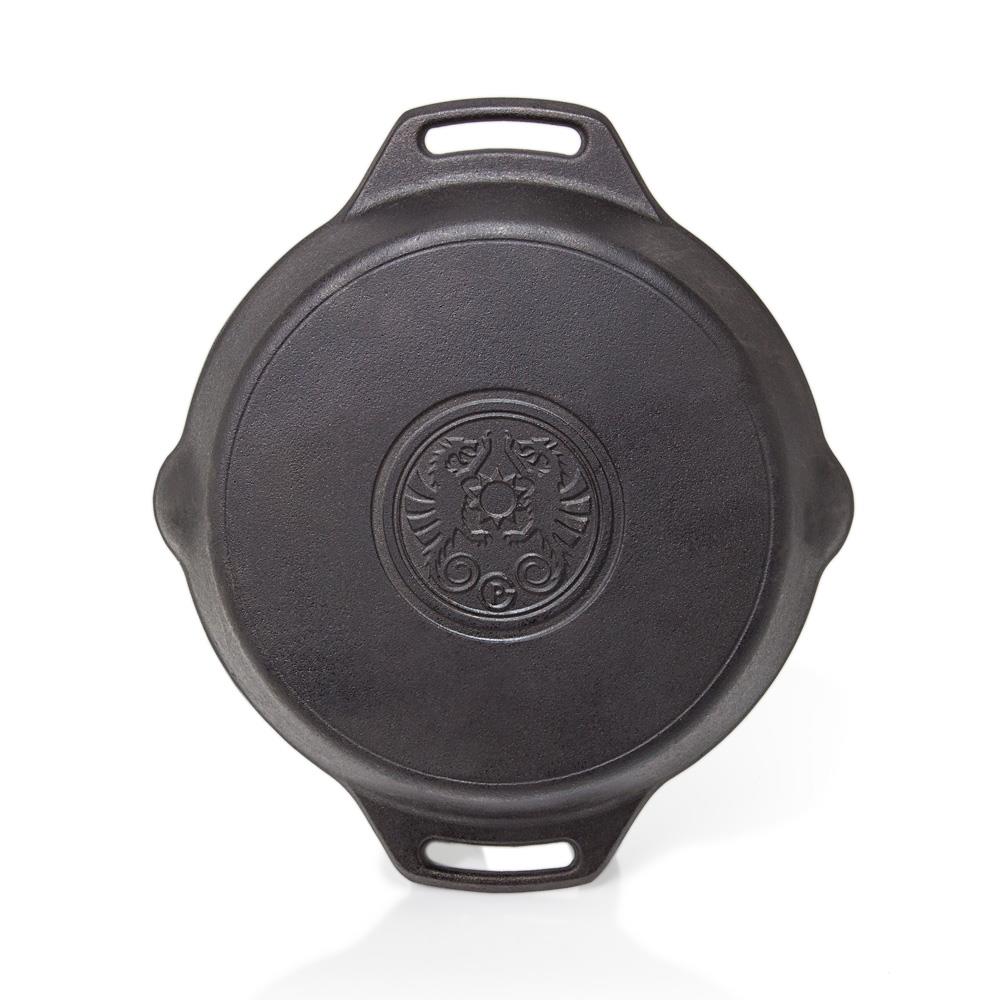 Top view of a heavy-duty cast iron fire skillet with two handles and an embossed emblem, perfect for use in farm, camping, kitchen, cookware, and cast iron collections.