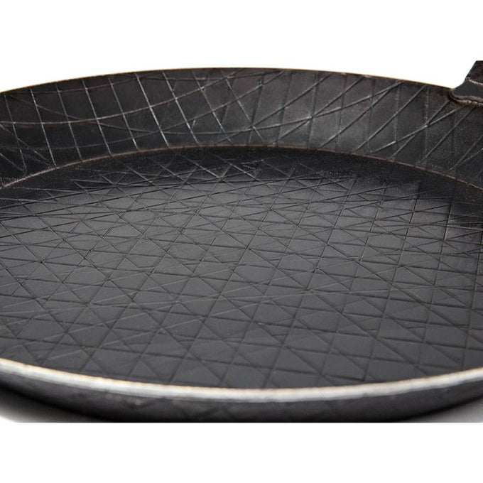 Handcrafted wrought iron pan featuring a textured crosshatch cooking surface, designed for durable outdoor and indoor use, ideal for Farm, Garden & Tool, Kitchen & Food, Camping, Cookware, Pots and Pans, Best Sellers, and Promo Eligible collections.