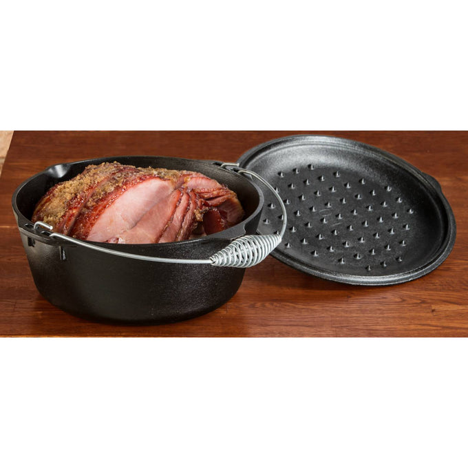 Black cast iron Dutch oven with spiral bail handle and self-basting lid featuring nubs, holding sliced roast, crafted in USA, perfect for Kitchen & Food, Cookware, Cast Iron, Best Sellers collections.