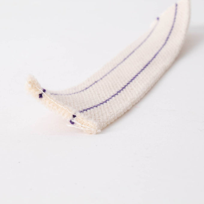 Close-up of a white cotton flat wick with thin purple stripes, designed for oil lamps, featured in Lamps & Lighting, Oil Lamps, Table Lamps, Best Sellers, and Promo Eligible collections.