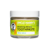 Handcrafted glass jar of Uncle Harry’s all-natural alkalizing mineral toothpaste in mild mint flavor with white lid and bright yellow-green label, ideal for Health & Wellness, Grooming and Personal Hygiene, USA Made, Best Sellers, and Promo Eligible collections.