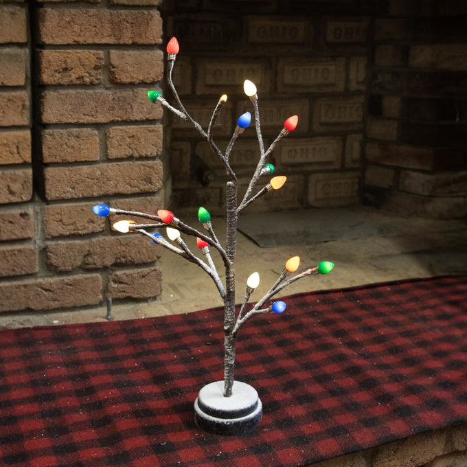 Handcrafted holiday tree with snow-frosted branches and colorful light bulb caps in red, green, blue, and white on a round base, perfect for Home & Decor, Holiday Decor, Best Sellers, and Promo Eligible collections.