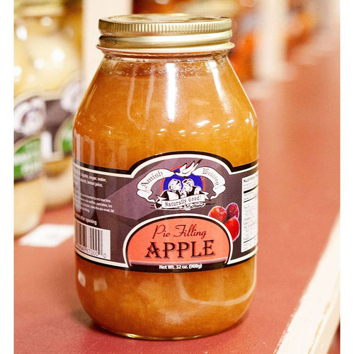 Handcrafted jar of Amish-made apple pie filling in a clear glass jar with a gold lid, naturally prepared without corn syrup or artificial coloring, part of Kitchen & Food, Pantry, USA Made, and Best Sellers collections.