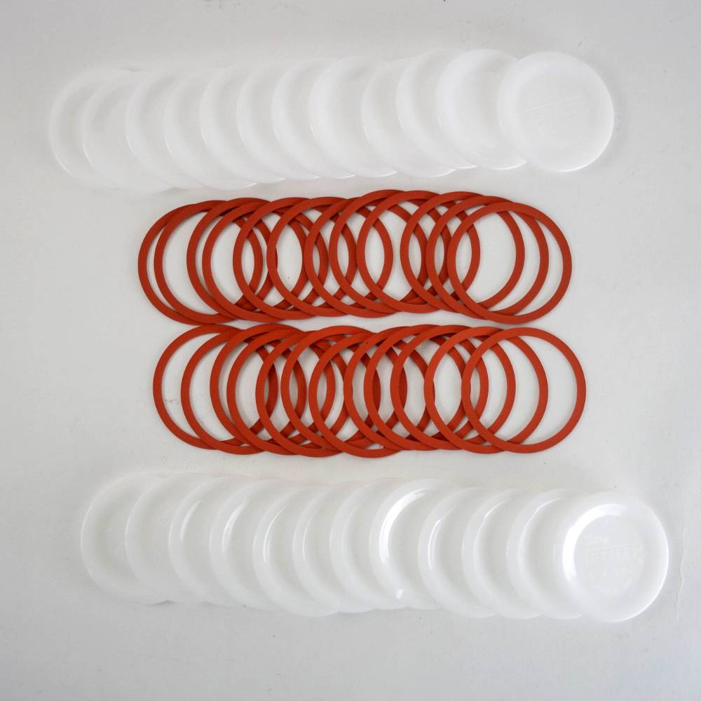 Set of reusable regular-sized canning jar lids and red sealing rings, handcrafted and made in USA, ideal for Kitchen & Food, Food Preservation, and Canning collections.